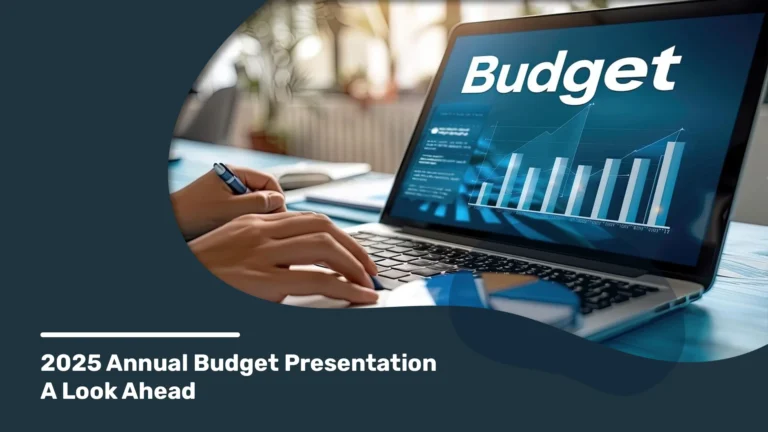 Close-up view of a person working on a laptop displaying a budget graph for the 2025 annual budget presentation.